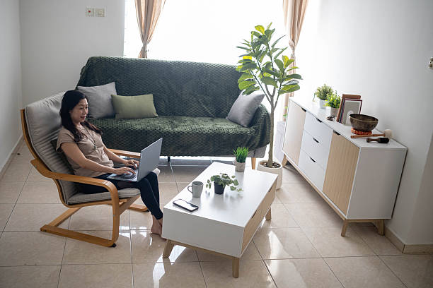 istock Focused Productivity: Businesswoman Working Remotely at Home Desk 2230438905