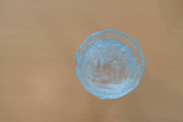istock Refreshing glass of cold water with ice, a liquid hydration thirst quencher. 2230441066