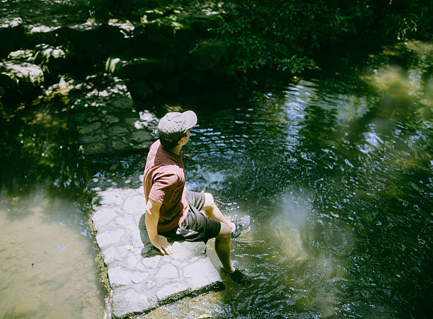 istock Traveler walking in the stream 2230441728