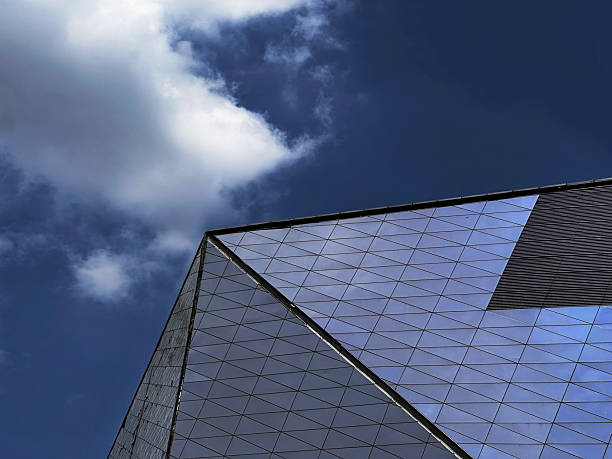 Faceted glass facade that reflects the sky and clouds. Crowned with a glass dome adorned with doves symbolising unity, the structure represents peace and harmony.