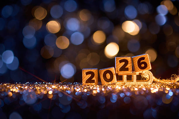 istock Wooden Number Blocks Displaying 2026 with Glittering Lights and Bokeh Background 2230451394