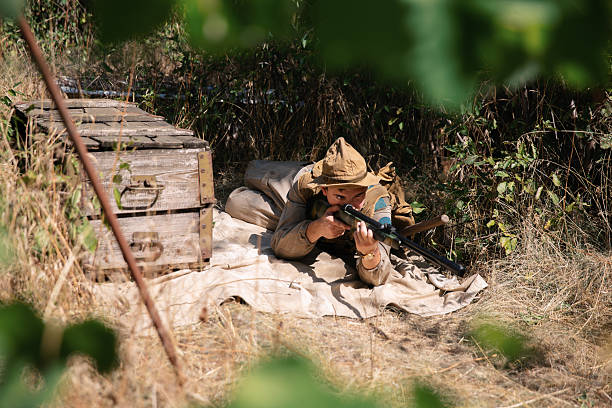 World war i soldier aiming with rifle during historical reenactment
