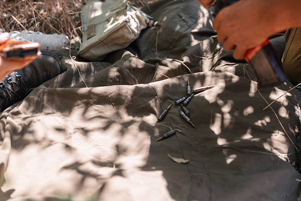 Soldiers preparing ammunition during a military operation in the forest