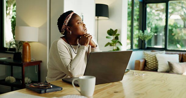 istock Remote work, laptop or black woman with thinking in home for creative inspiration, planning or ideas. Freelancer, journalist and tech with insight for article brainstorming and submission decision 2230456756