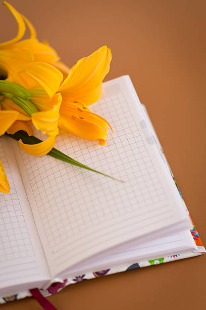 Floral notebook background in Pantone Mocha Mousse tone.