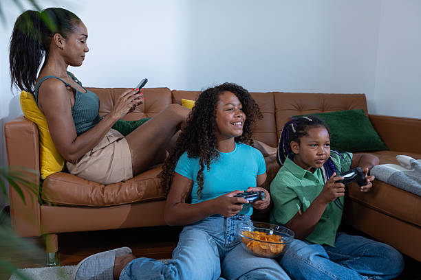 istock Children gamers playing video games on a console together as at home. 2230459119