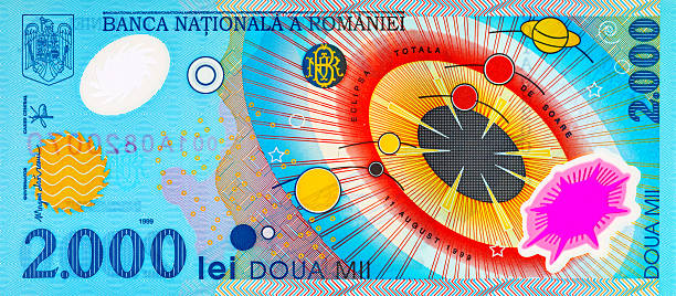 istock 2000 Lei Romania, 1999 with a simplified Solar System and a solar eclipse. Polymer money of Romania and Europe. 2230469116