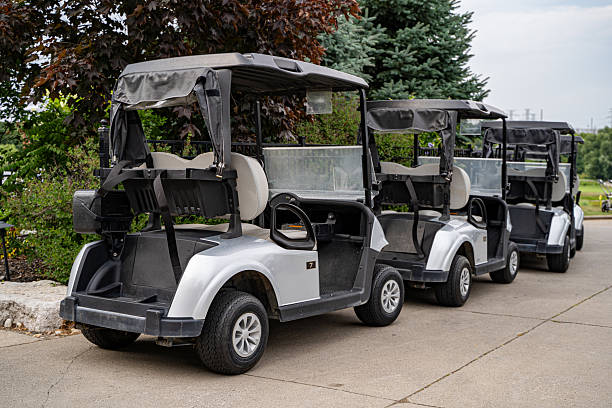 istock View of golf carts parked at golf club. 2230470284
