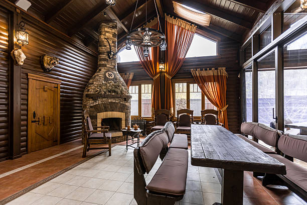 istock A large room with a fireplace and a long wooden table 2230471333