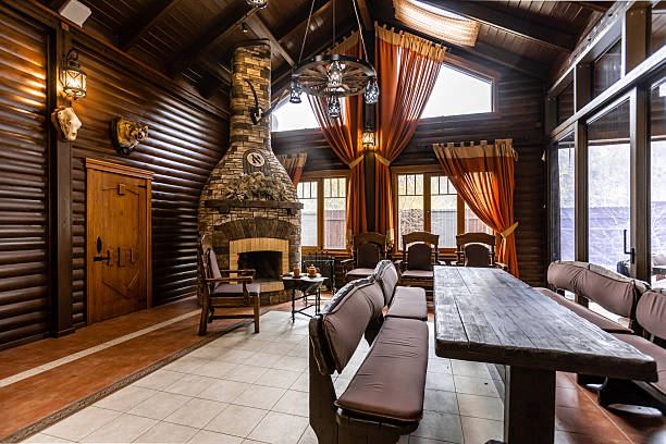 istock A large room with a fireplace and a long wooden table 2230471438