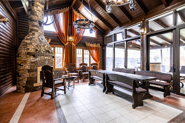 istock A large room with a fireplace and a long wooden table 2230475676