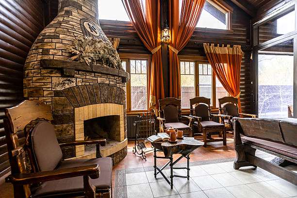 istock A large room with a fireplace and a long wooden table 2230475749
