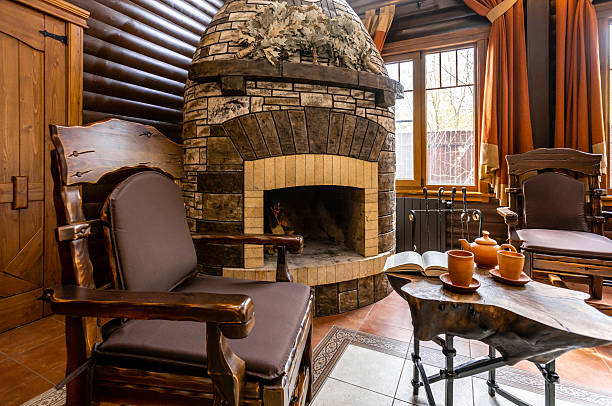 istock A large room with a fireplace and a long wooden table 2230476033