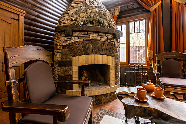 istock A large room with a fireplace and a long wooden table 2230476136