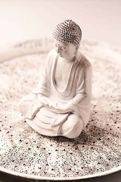 istock Meditating Buddha Statue on bright background. Soft focus. Copy space. 2230478684