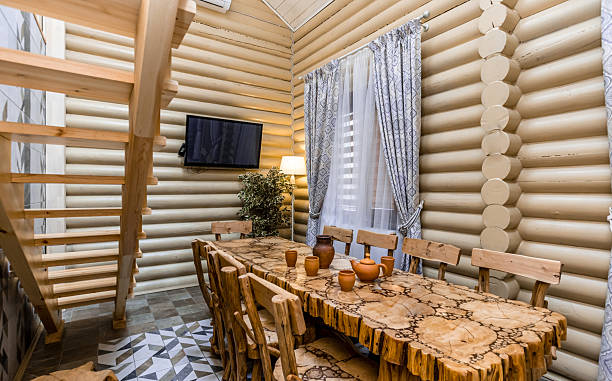 contemporary kitchen with wooden details, minimalistic interior design, modern furniture with accessories and various utensils, table and chairs in dinning room