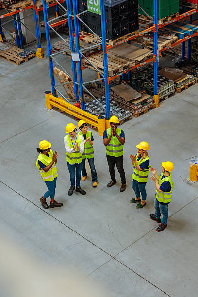 istock Top view of warehouse workers clapping their hands 2230483751