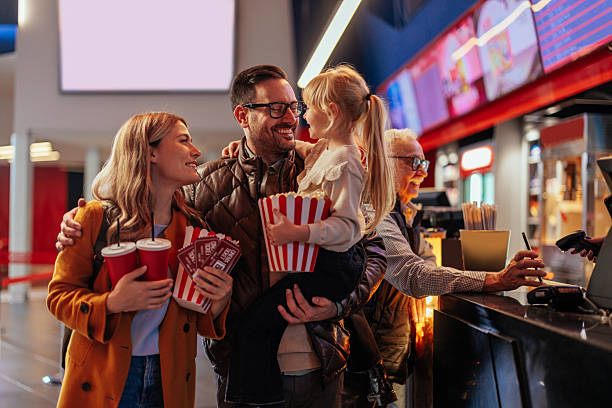 istock Joyful family in cinema hall. 2230483840