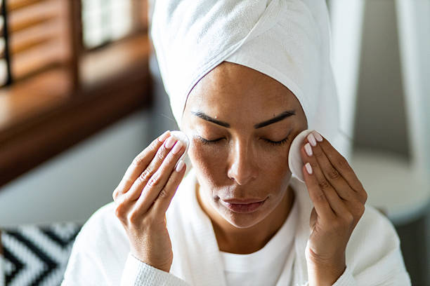 istock Woman focused on her morning skincare routine 2230485459
