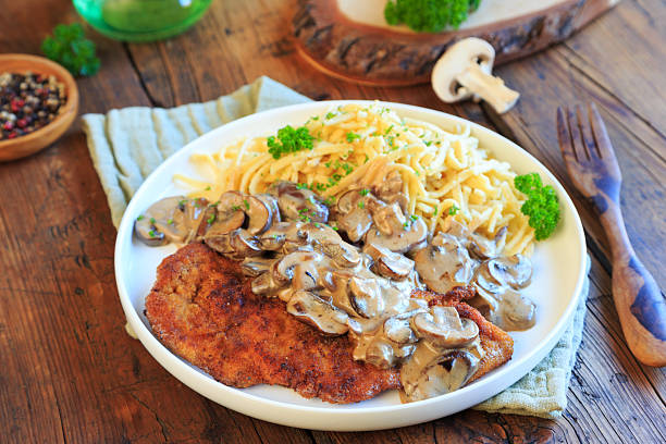 Schnitzel hunter style with spaetzle and mushrooms