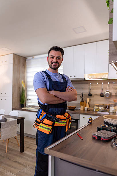 istock Skilled handyman stands confidently in modern kitchen, preparing for home repair tasks 2230490318