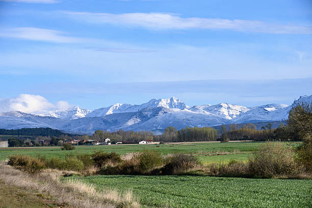istock Scenic road towards a Palencia village with mountain backdrop 2230490618