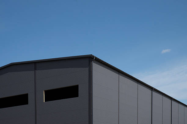 istock Industrial metal panel building facade under blue sky 2230497943