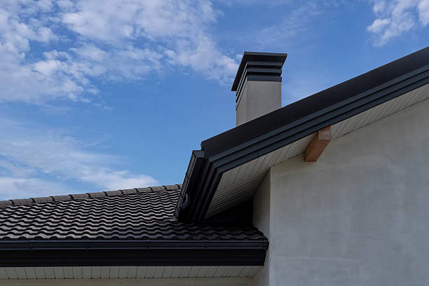 istock Chimney on gable roof with metal tile and vented soffit 2230498576