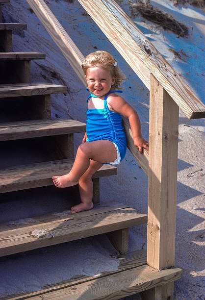 istock Cape Hatteras NS - Girl on Boardwalk Steps - 1983 2230502235
