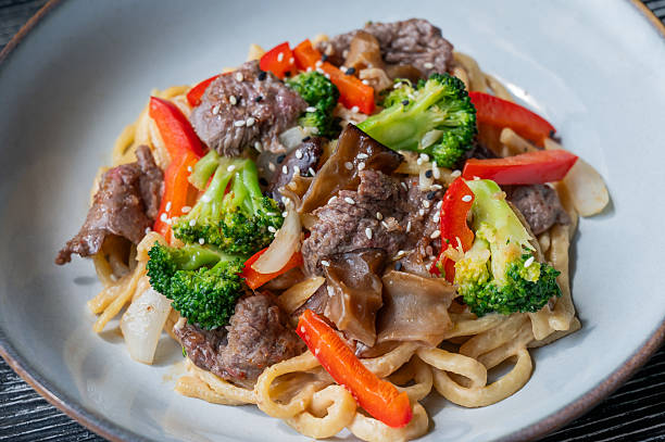 istock Top view of pasta with beef and broccoli. 2230506955