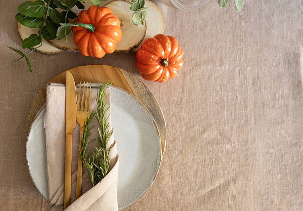 istock Festive Thanksgiving tableware with artesian plate , gold cutlery, and autumn pumpkin, visual content for social media 2230508363