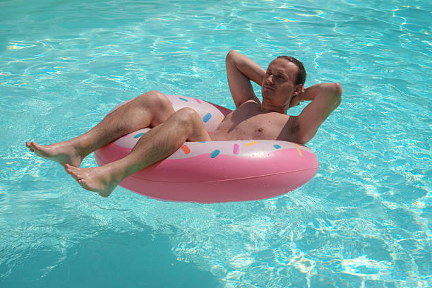 Man relaxing in swimming pool Inflatable Swimming Ring