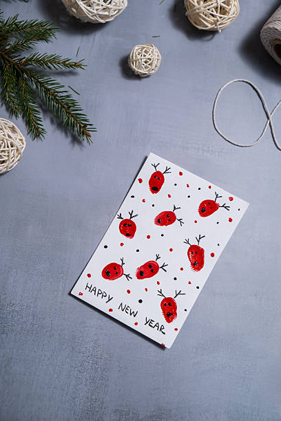 istock Reindeer fingerprints Gift Christmas idea. Do it yourself instruction postcard eco-friendly decoration. Making handmade presents children's diy projects. Holiday family time 2230515231