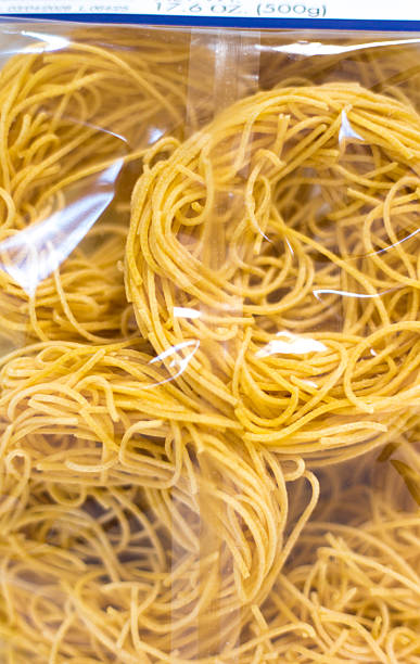 Raw/Uncooked Angel Hair Pasta in Package Close-Up Full Frame