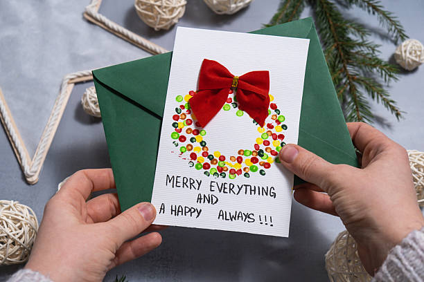 istock Christmas wreath Gift Christmas idea. Do it yourself instruction postcard eco-friendly decoration. Making handmade presents children's diy projects. Holiday family time 2230516123