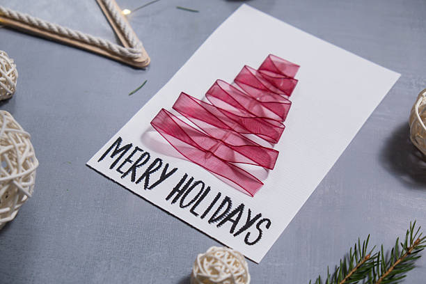istock Christmas tree ribbon Gift Christmas idea. Do it yourself instruction postcard eco-friendly decoration. Making handmade presents children's diy projects. Holiday family time 2230516339