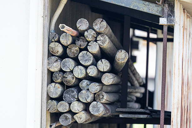 Chopped firewood in a wooden shelter