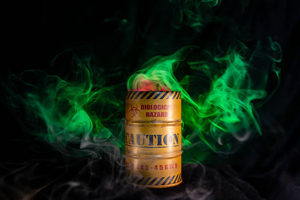 istock Biohazard drum with red and green smoke billowing 2230518978
