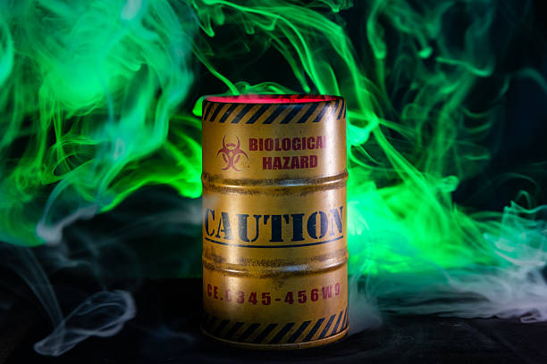 Biohazard drum with red and green smoke billowing