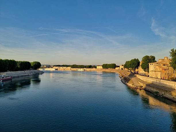 View on Avigon at the river Rhone with the Pont d'Avignon and the Papal Palace in the city of Avigon in the Vaucluse department in the Provence-Alpes-Côte d'Azur region of southeastern France. Located on the left bank of the river Rhône. Avignon is also known as 'La Cité des Papes' (The City of the Popes). Avignon is also known as 'La Cité des Papes' (The City of the Popes)