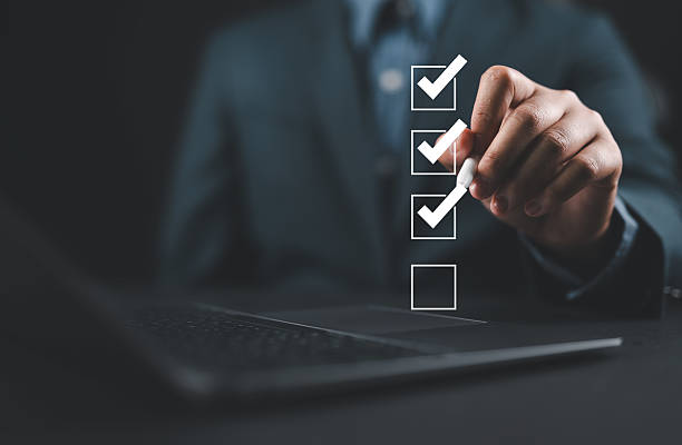 istock Businessman use pen to tick correct sign mark in checkbox for quality document control checklist and business approve project concept. 2230521673