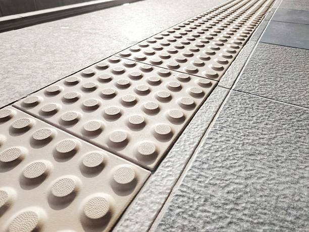 istock Braille pavement - Stripes tactile paving surface or the blind 2230526771