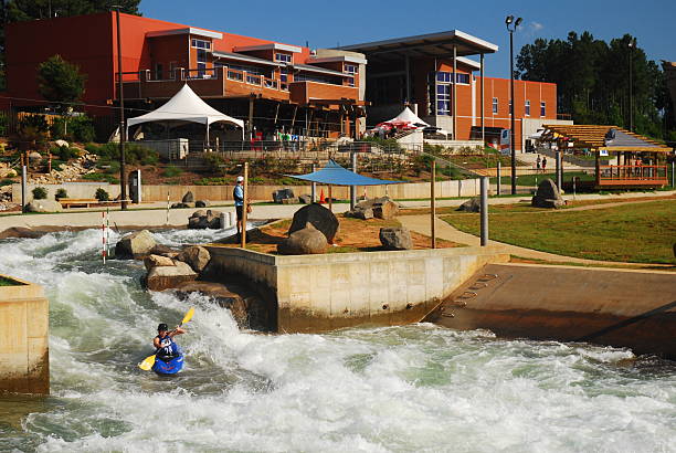 Charlotte, NC, USA June 16 A lone kayaker practices his rough water skills at a manmade rapids at the US Whitewater Center in Charlotte, North Carolina