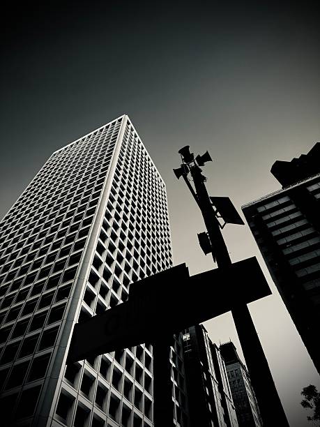 Looking up at a harsh modern building.