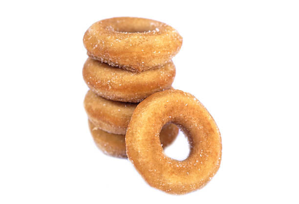 istock Homemade sugar milk donuts on white background, soft and fluffy texture, buttery aroma, fried snack. Delicious treat for eating or selling, concept of fried pastry and sweet dessert. 2230530679