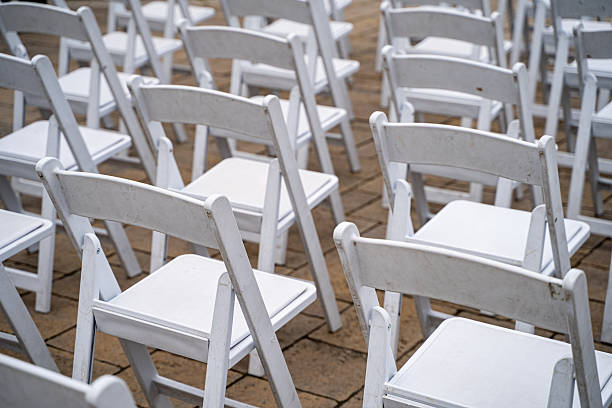 istock Outdoor wedding ceremony setup with white chairs. 2230536810