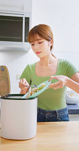 istock woman use food Waste Disposer 2230541344