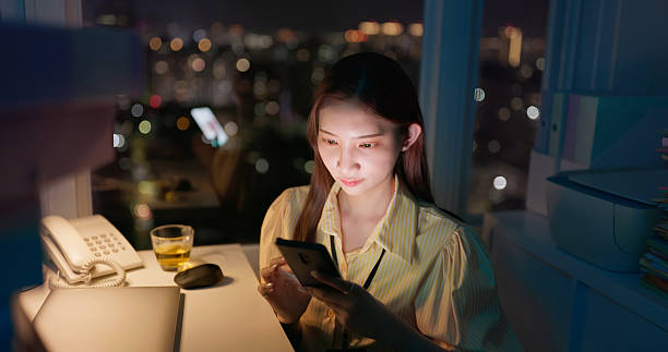 istock business woman using mobile phone check information 2230541749
