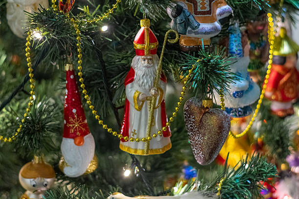 istock Tree with many ornaments, including a nativity scene, a santa Claus, and a man with a scepter 2230541880