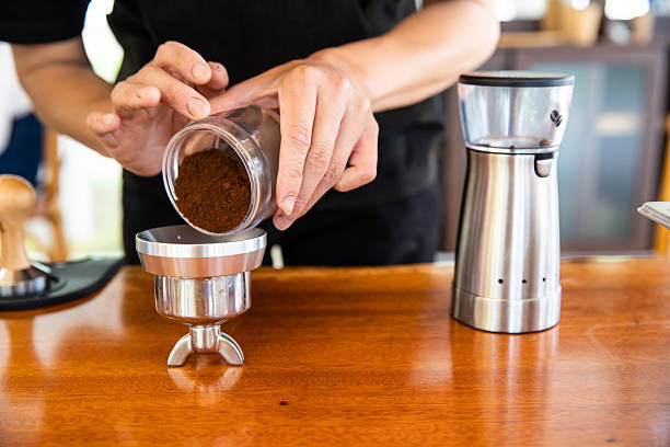 istock The process of grinding coffee beans in a coffee shop 2230546763